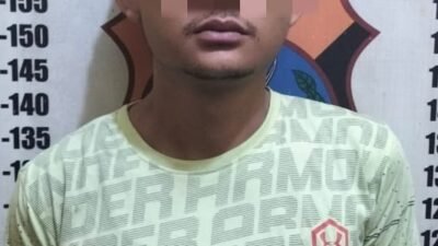Pelaku yang diamankan pihak kepolisian.