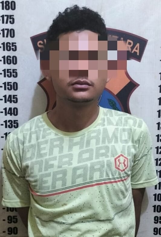 Pelaku yang diamankan pihak kepolisian.